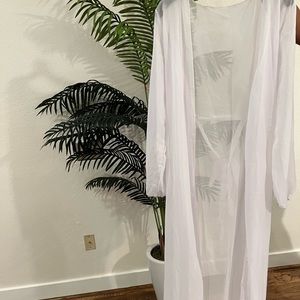 White swimsuit cover up. Never worn.